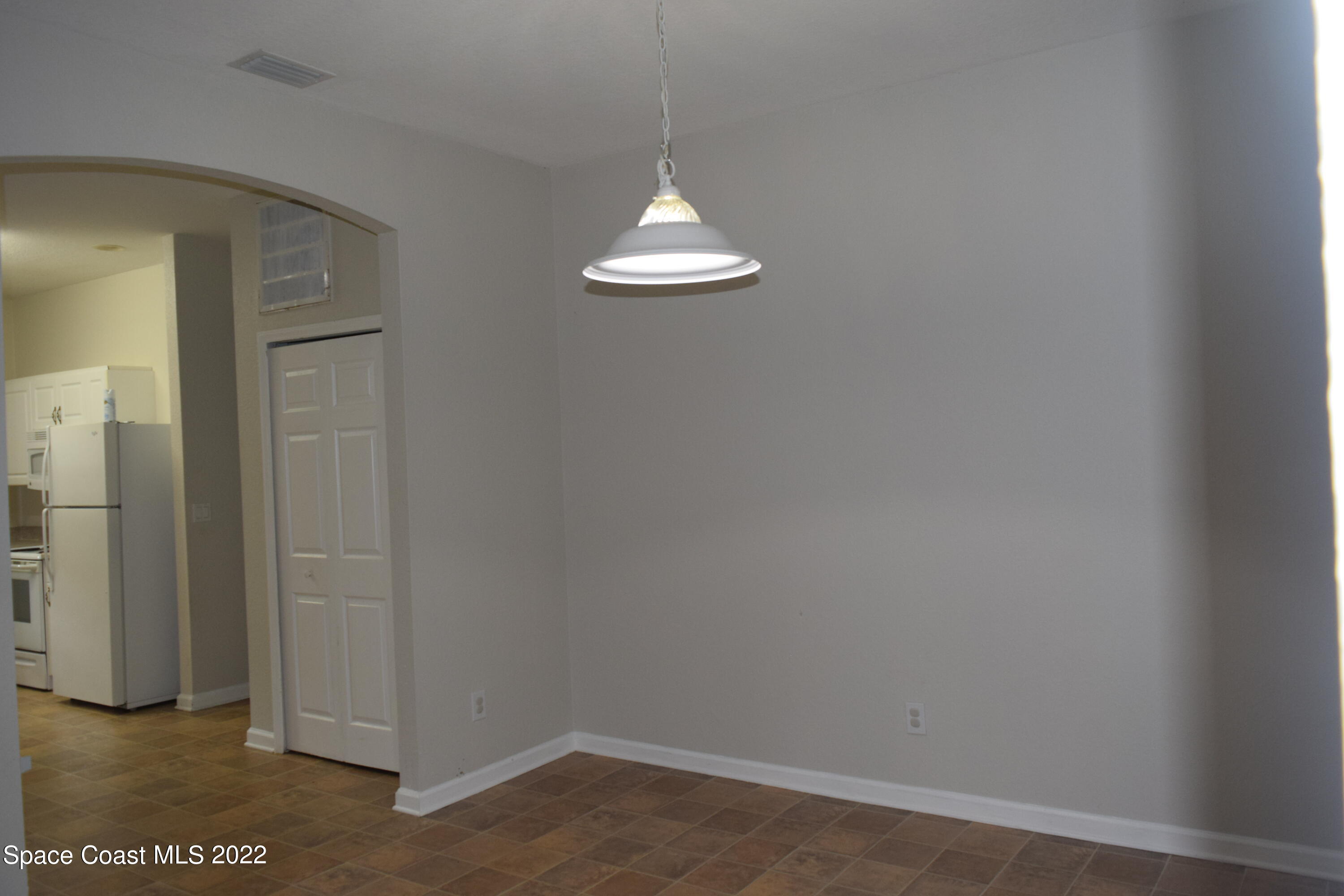 271 Titan Road Southeast Palm Bay, FL 32909 - Photo 4 of 22 an empty room with a window