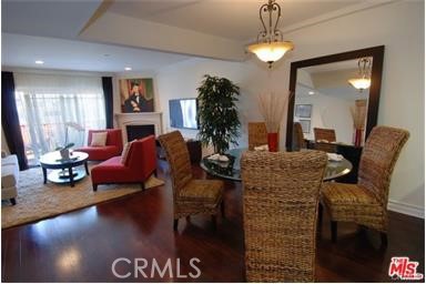 11848 Kiowa Avenue, Unit 101 Los Angeles, CA 90049 - Photo 8 of 11 a living room with furniture and a chandelier