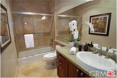 11848 Kiowa Avenue, Unit 101 Los Angeles, CA 90049 - Photo 10 of 11 a bathroom with a sink toilet and shower