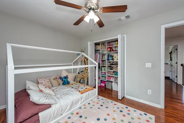a bedroom with furniture and a chandelier