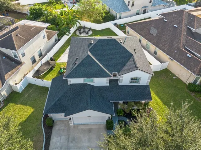 an aerial view of residential houses with outdoor space
