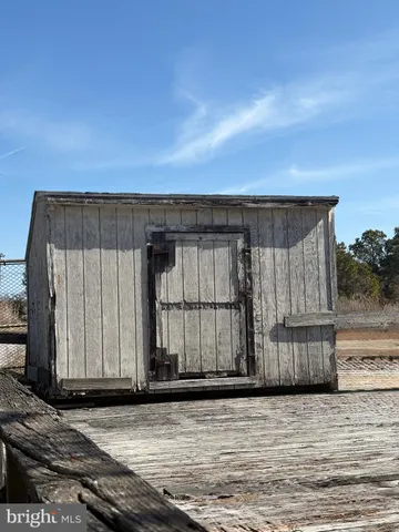 a view of a kitchen with a sink and cabinets