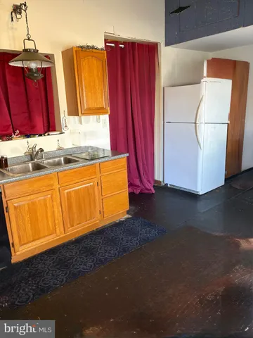 a living room with a couch and next to a window