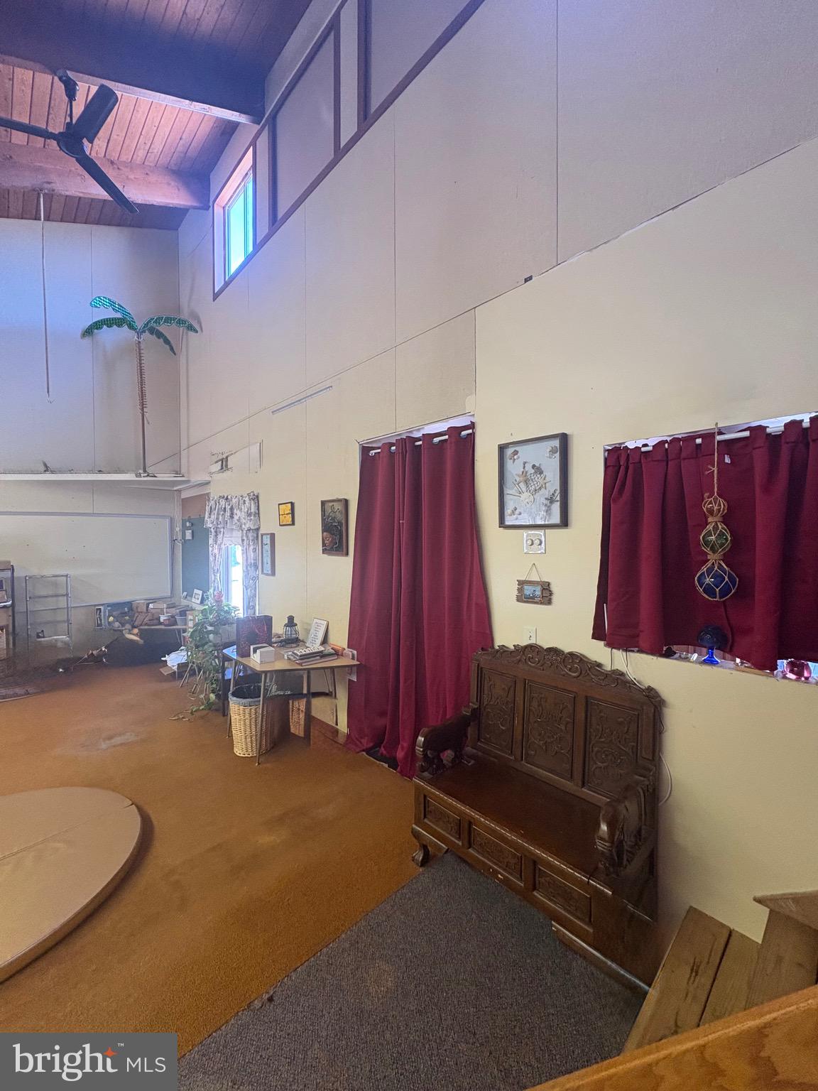3019 Union Church Road Tylerton, MD 21866 - Photo 22 of 41 a living room with patio furniture and a dining table