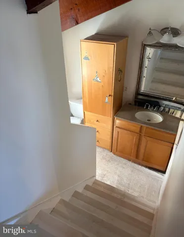 a bedroom with a bed and a mirror