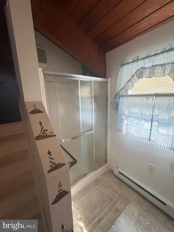 a view of beach and an ocean