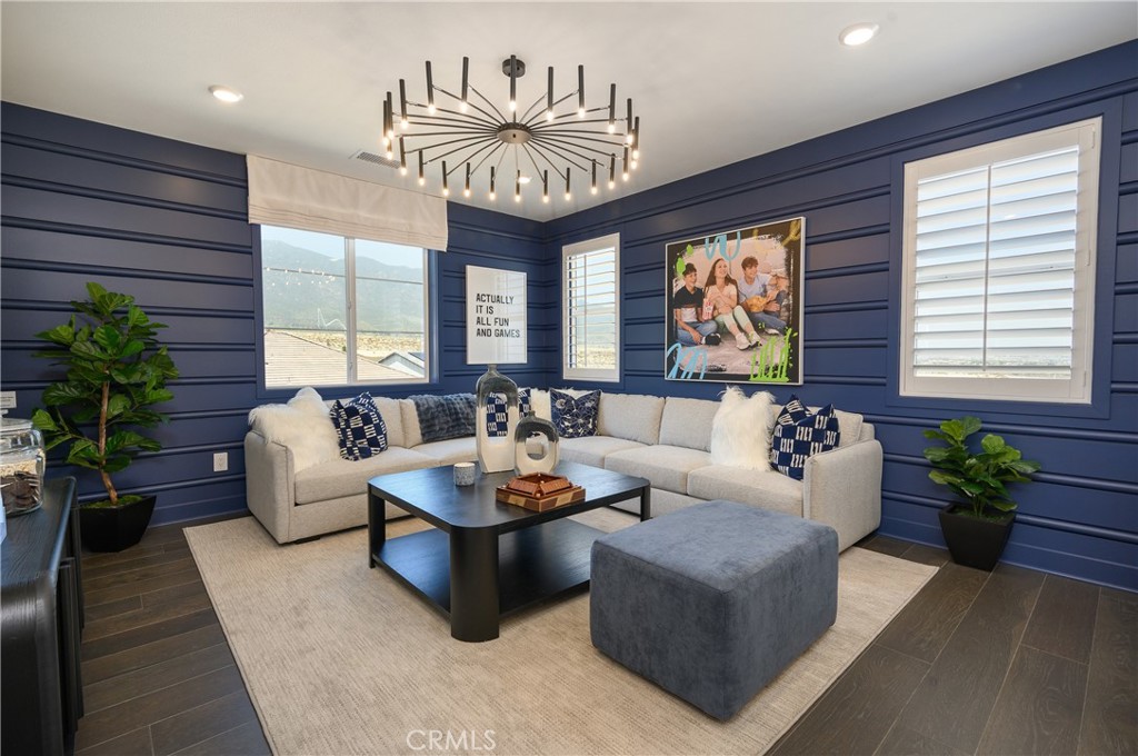 13093 Edgware Drive Rancho Cucamonga, CA 91739 - Photo 12 of 25 a living room with furniture and a large window