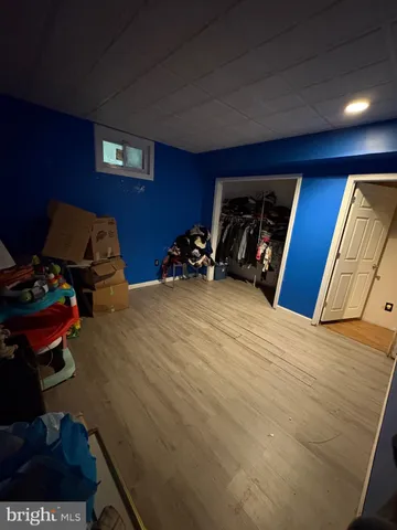 a bedroom with a bed a lamp and window