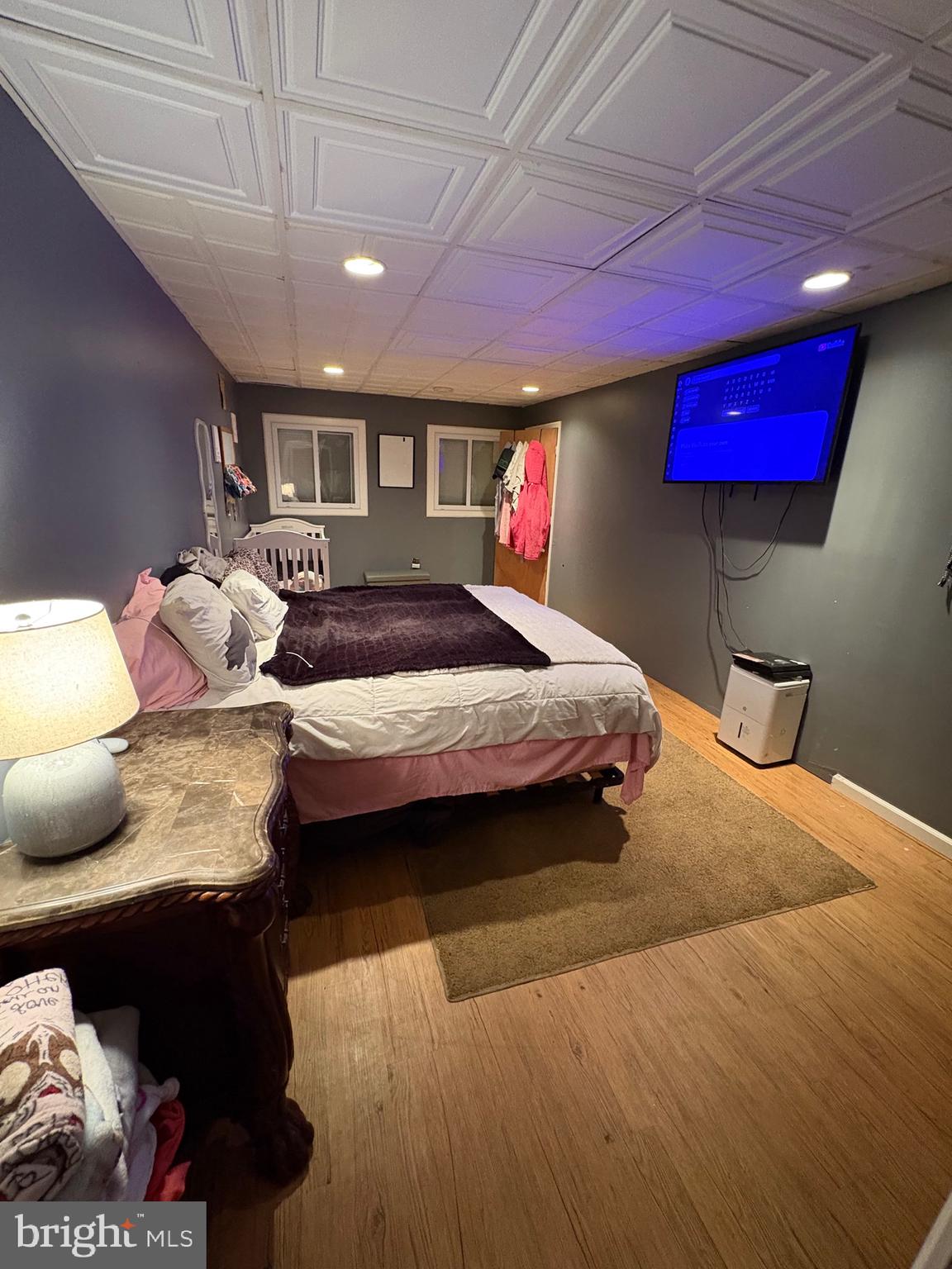 12 Deborah Drive Millville, NJ 08332 - Photo 19 of 52 a bedroom with a bed a lamp and window