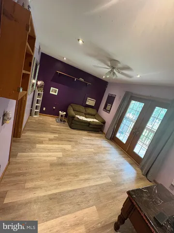 a view of an empty room with windows