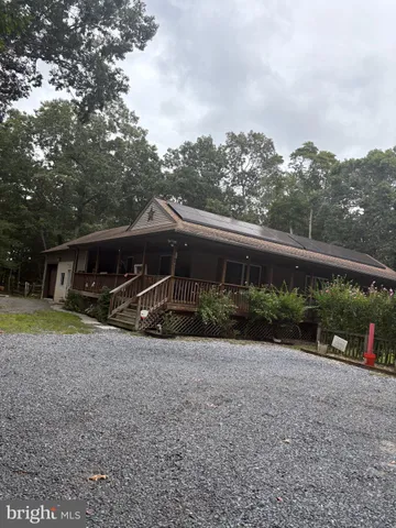 front view of a brick building with a small yard