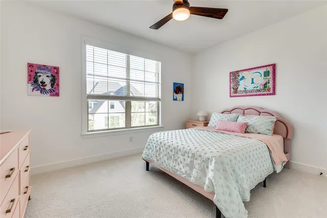 a bed room with a bed and a chair