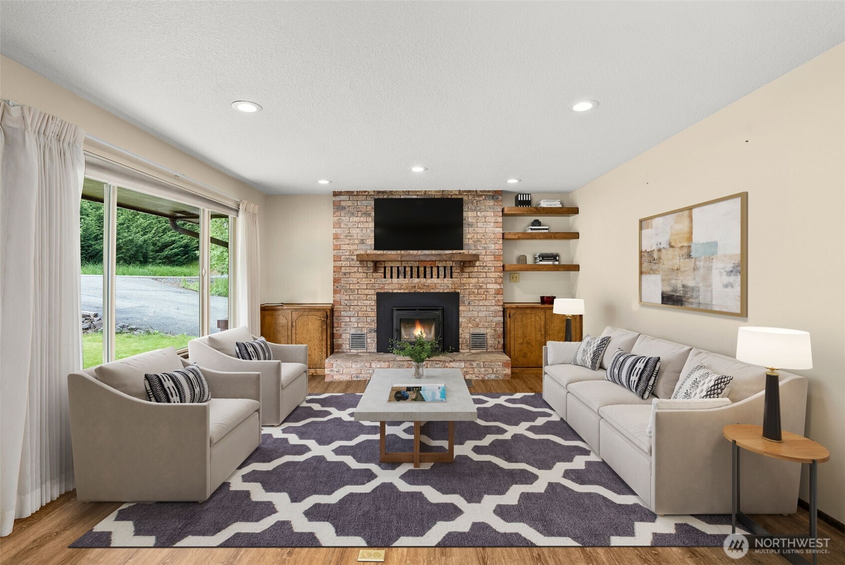 154 Sanderson Road Chehalis, WA 98532 - Photo 11 of 27 a living room with furniture a flat screen tv and a fireplace