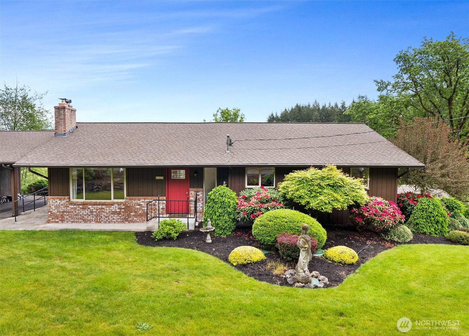 154 Sanderson Road Chehalis, WA 98532 - Photo 2 of 27 a view of a house with a garden and yard