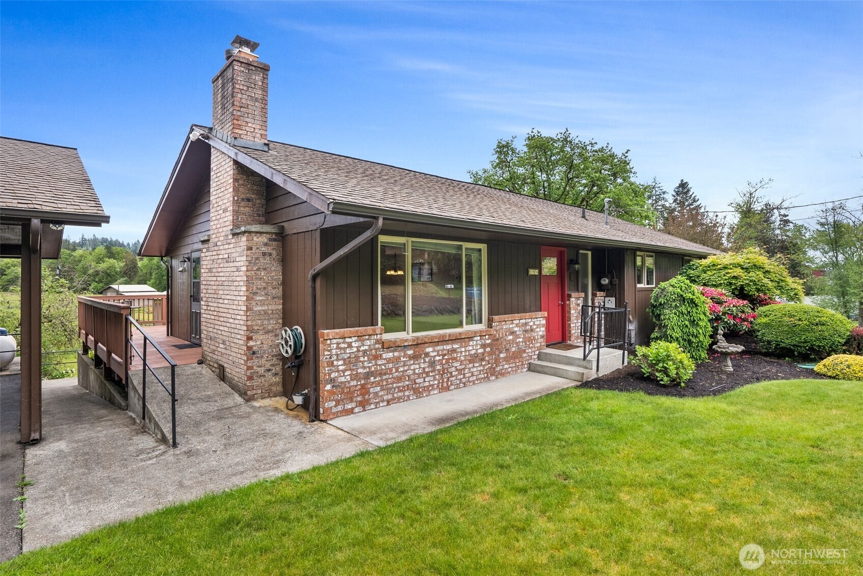 154 Sanderson Road Chehalis, WA 98532 - Photo 3 of 27 a view of a house with backyard sitting area and garden