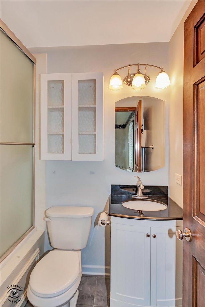 9 Cebold Drive Montgomery, IL 60538 - Photo 14 of 30 a bathroom with a granite countertop toilet sink and mirror