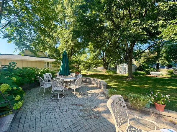 a view of yard with swimming pool and trees