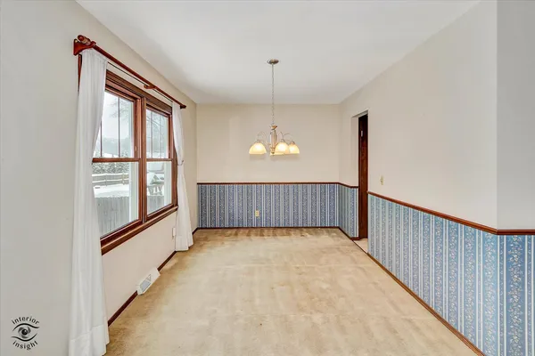 a view of a hallway with a window