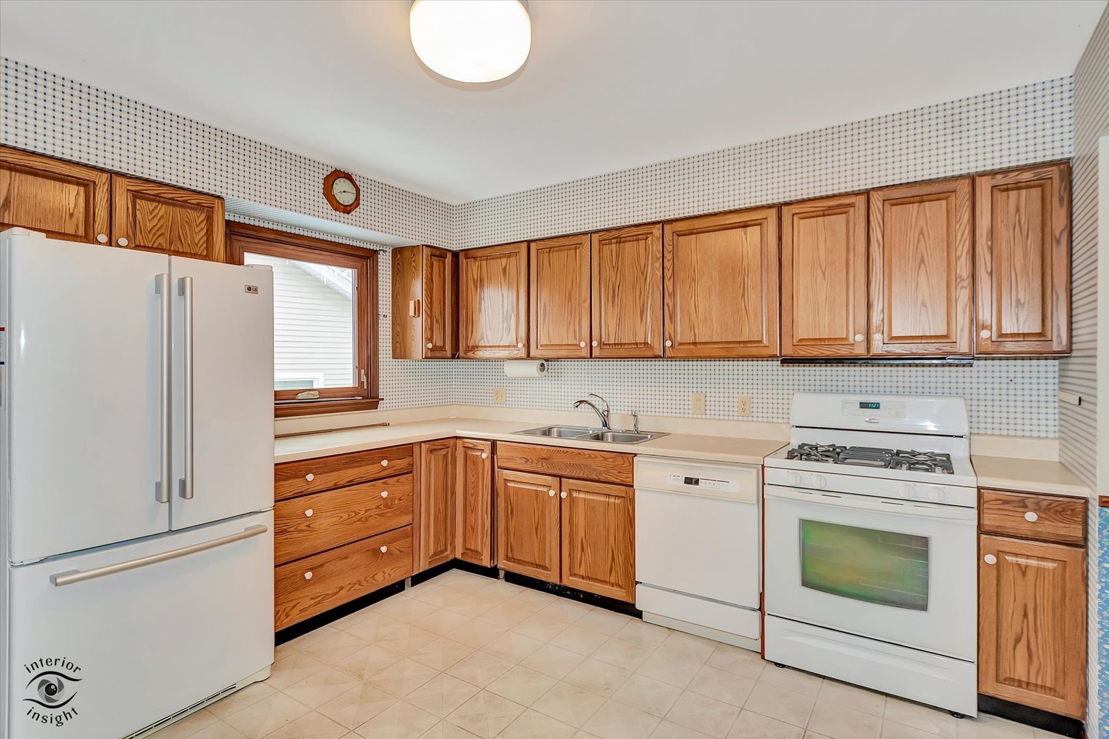 9 Cebold Drive Montgomery, IL 60538 - Photo 7 of 30 a kitchen with white cabinets and white appliances