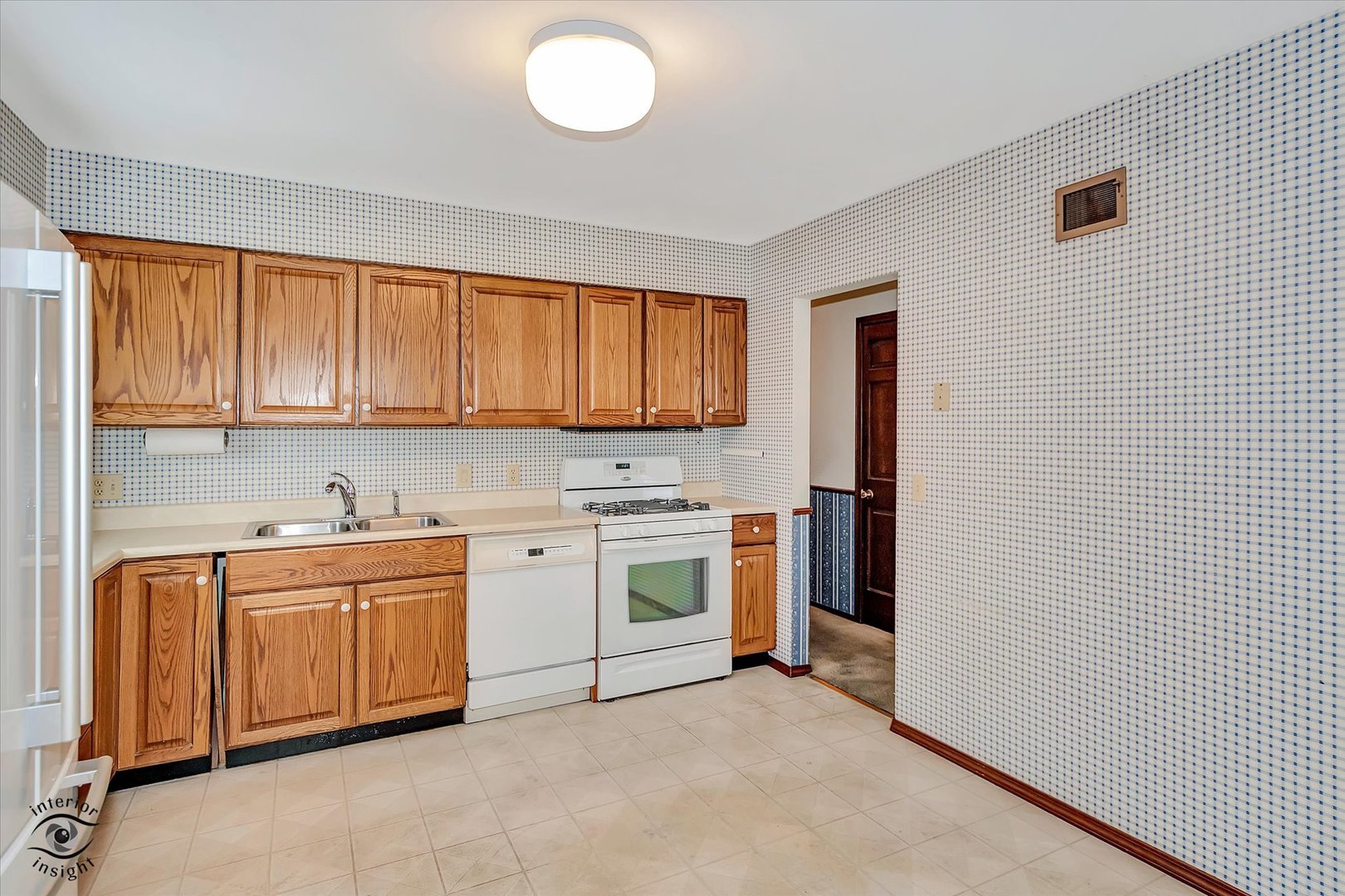 9 Cebold Drive Montgomery, IL 60538 - Photo 9 of 30 a kitchen with a stove top oven sink and cabinets