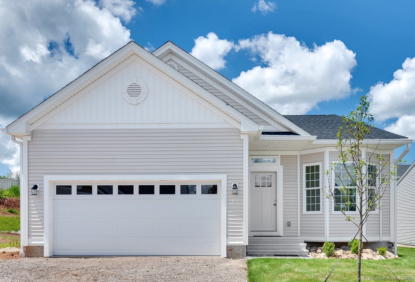 145 Webster Lane, Unit 241 Middletown, CT 06457 - Photo 1 of 22 a front view of a house with a yard