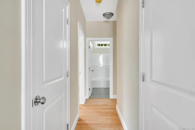 a bedroom with bed and window