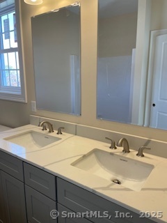 145 Webster Lane, Unit 241 Middletown, CT 06457 - Photo 14 of 22 a bathroom with a sink and a mirror