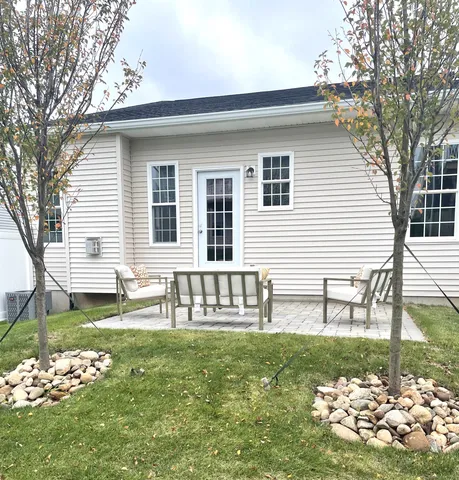 a view of empty room with wooden ceiling
