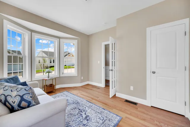 a living room with furniture and a rug