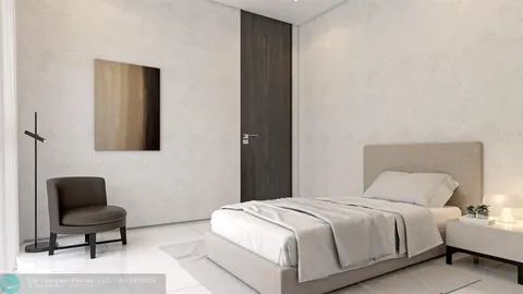 a living room with furniture and a open kitchen view