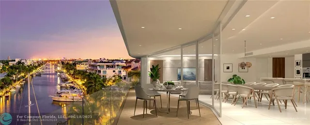 a view of a terrace with couches and city view