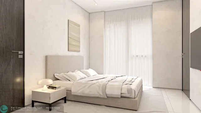 a bedroom with a bed and a chair