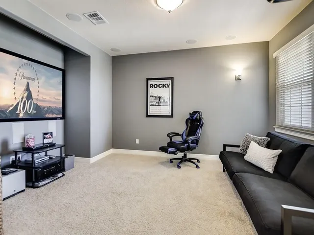a living room with furniture and window