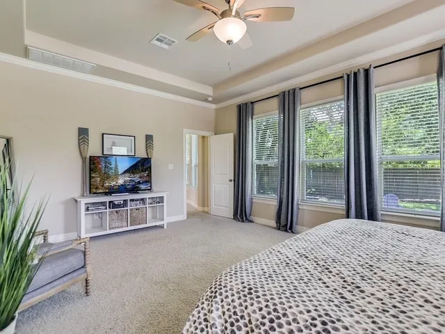 a bedroom with furniture and window