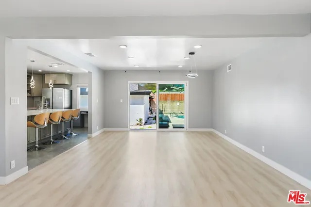 a view of a livingroom with furniture and a window