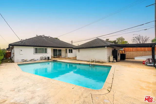 a view of a house with swimming pool