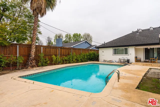 a view of a house with swimming pool