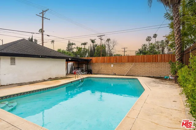 a view of swimming pool with a yard
