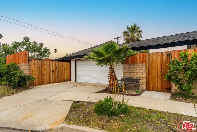 a front view of a house with a garage