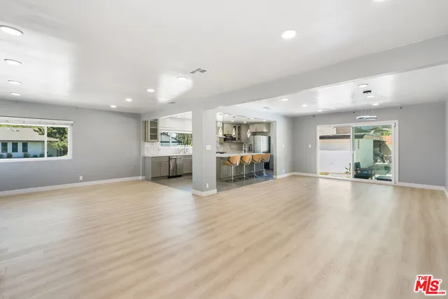 a view of a livingroom with furniture and a stove