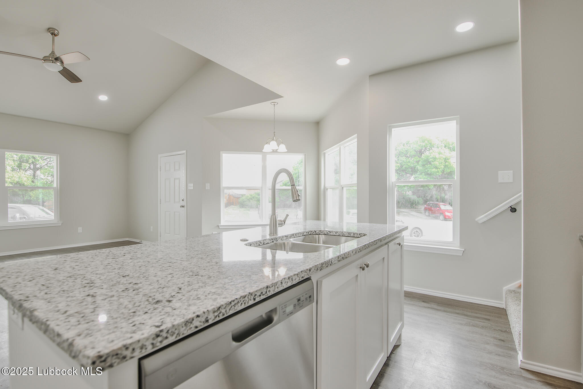 3115 74th Street Lubbock, TX 79423 - Photo 12 of 36 a bathroom with a granite countertop sink and a window