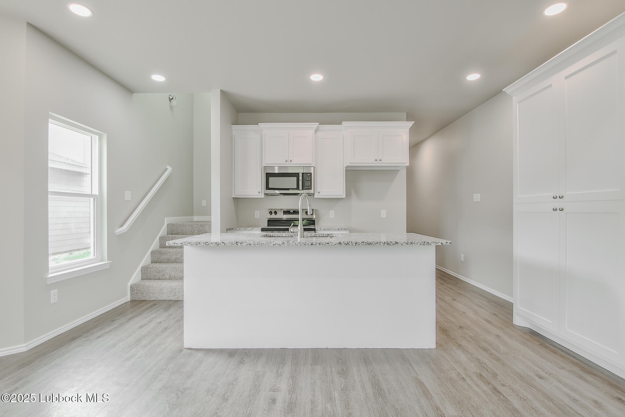 3115 74th Street Lubbock, TX 79423 - Photo 9 of 36 a view of kitchen with sink and wooden floor
