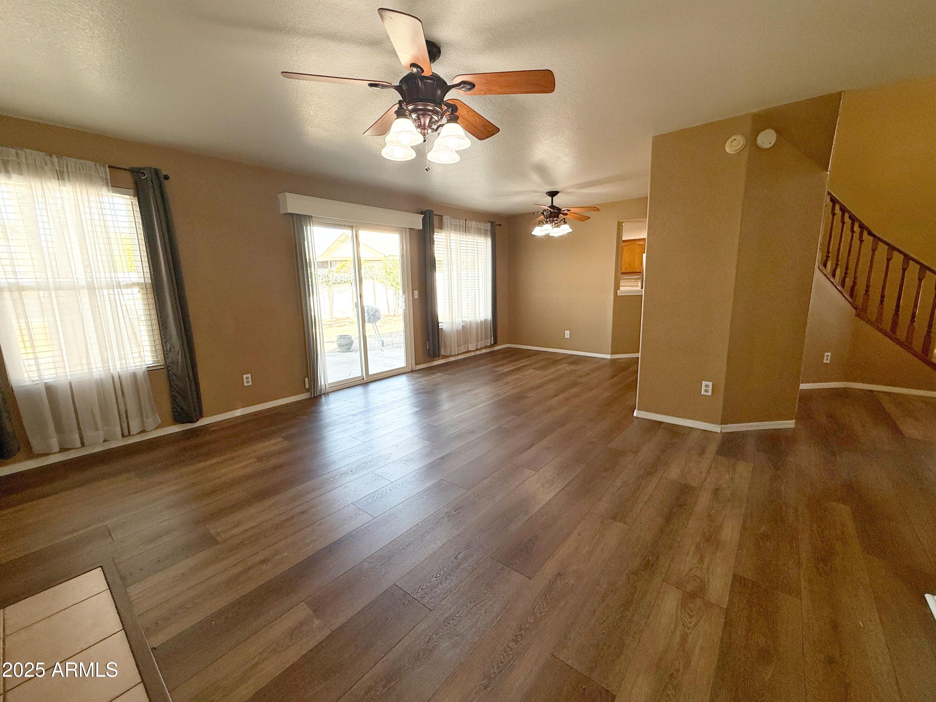 1670 East Gary Drive Chandler, AZ 85225 - Photo 11 of 34 a view of an empty room with a window and wooden floor