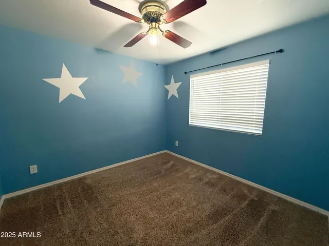 a view of a room with a fan
