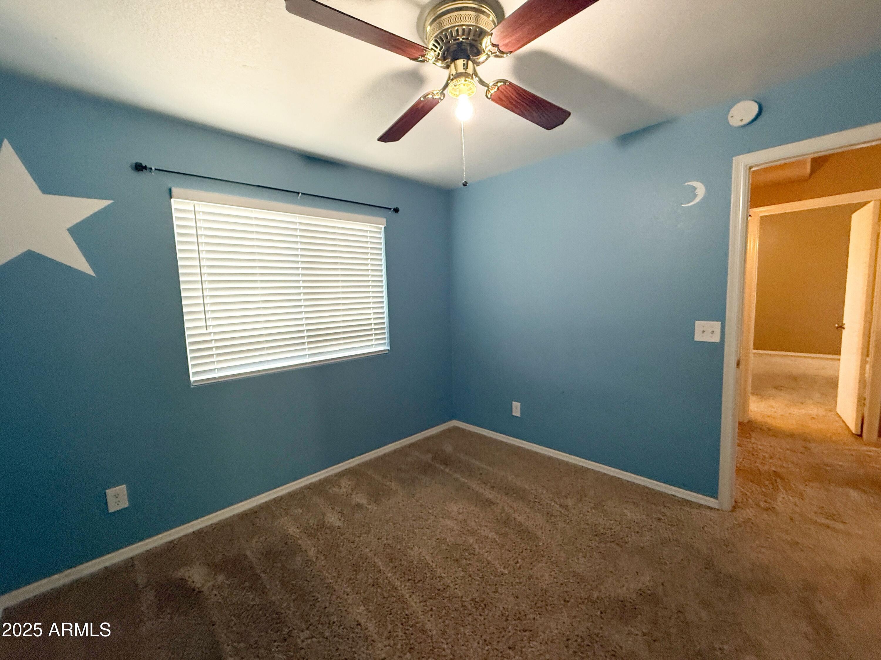 1670 East Gary Drive Chandler, AZ 85225 - Photo 17 of 34 a view of a room with a ceiling fan and a window