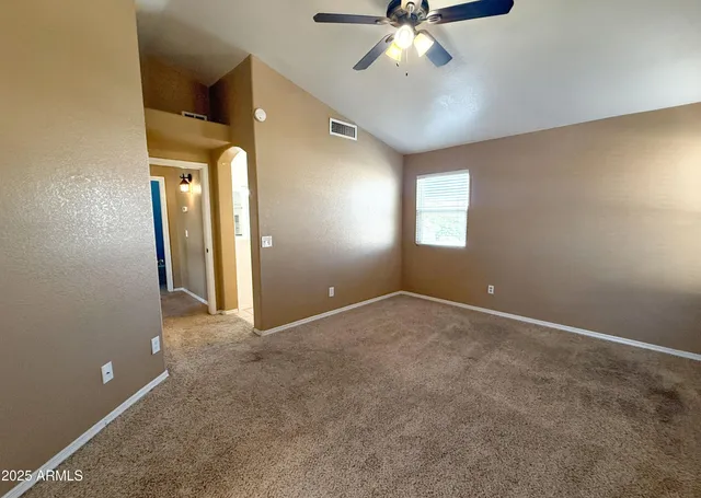 en view interior of a house with a chandelier fan and windows