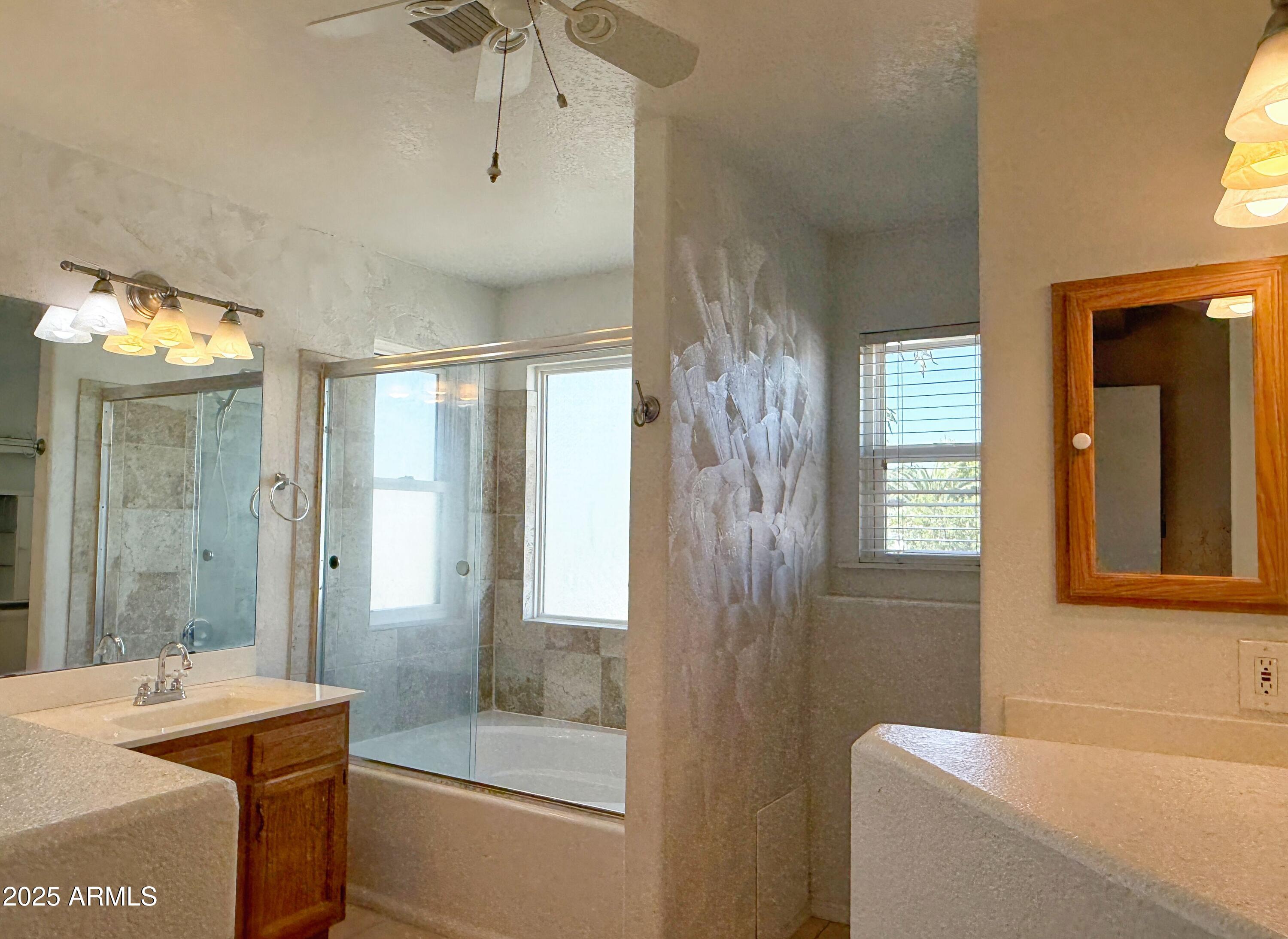 1670 East Gary Drive Chandler, AZ 85225 - Photo 25 of 34 a bathroom with a tub sink shower and mirror