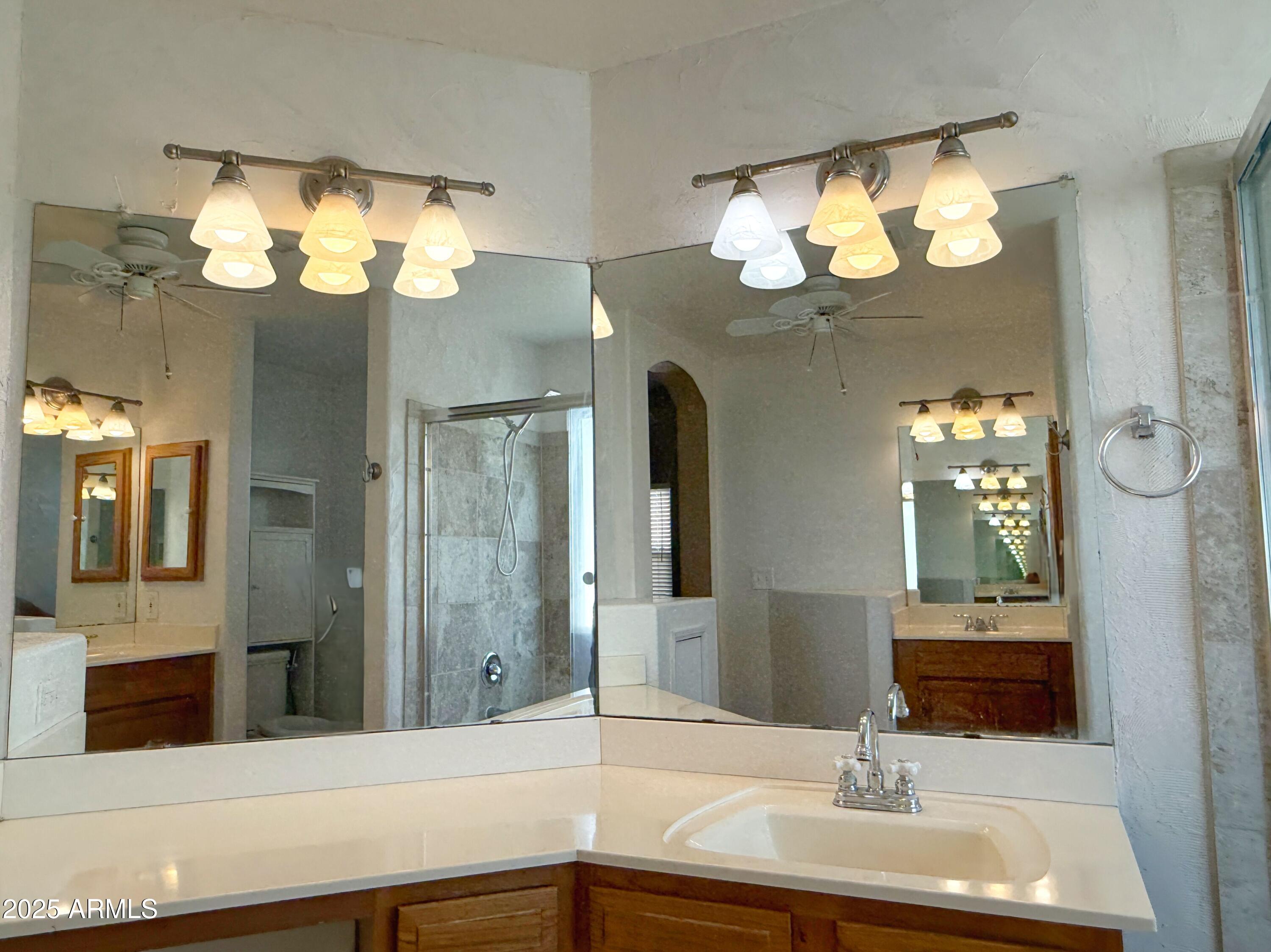 1670 East Gary Drive Chandler, AZ 85225 - Photo 26 of 34 a bathroom with a sink and a mirror