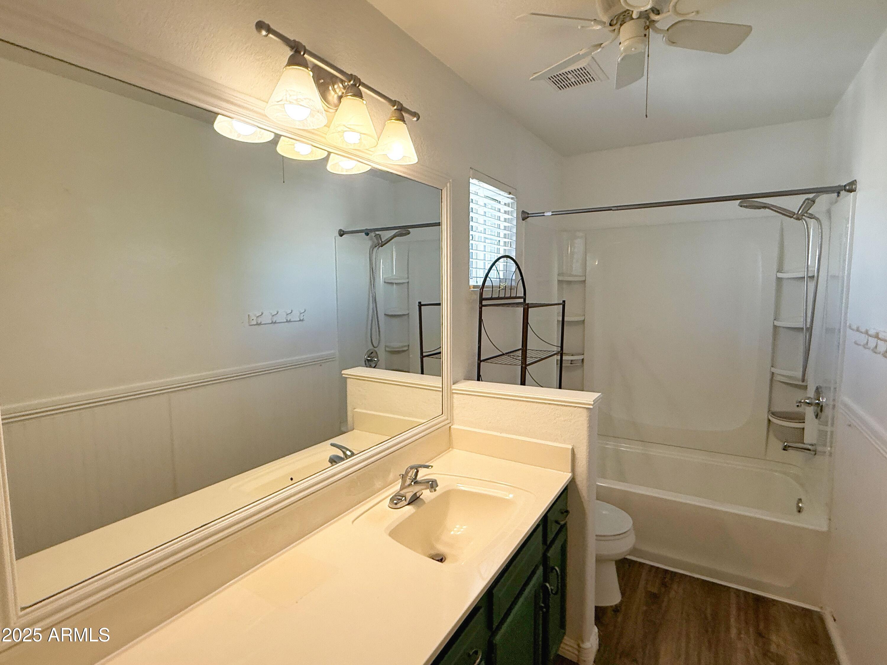 1670 East Gary Drive Chandler, AZ 85225 - Photo 28 of 34 a bathroom with a tub sink vanity and mirror