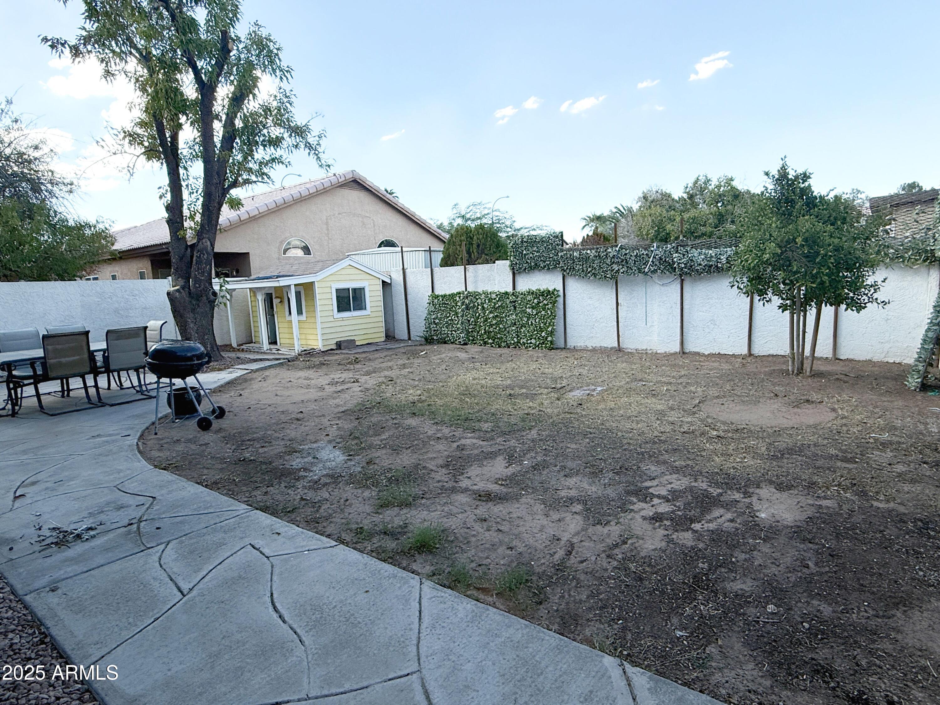 1670 East Gary Drive Chandler, AZ 85225 - Photo 31 of 34 a view of a house with a backyard